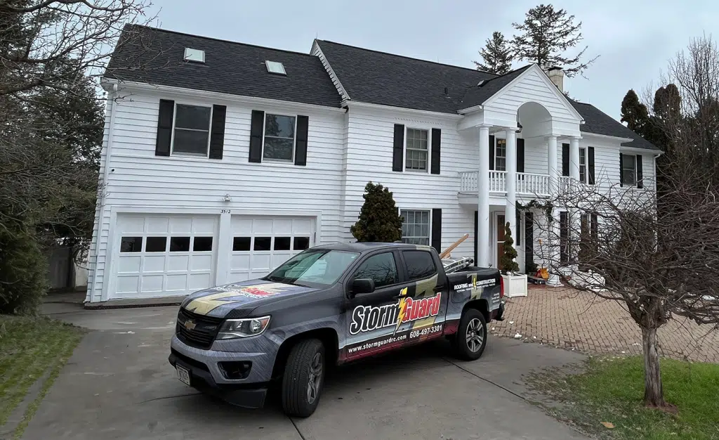 Storm Guard Car infront of Residential Property