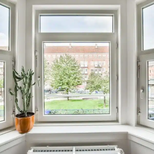 Man in red polo inspecting roof